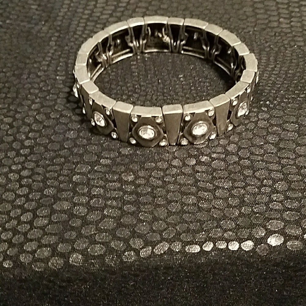 Silver bracelet with embedded crystals